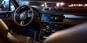 Couple Driving Porsche Cayenne in Houston TX