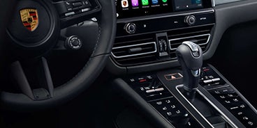 Man Stepping Out of the Porsche Macan Houston TX