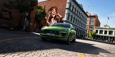 Blue Porsche Macan Turning a Corner in Houston TX