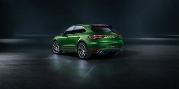 Man Stepping Out of the Porsche Macan Houston TX